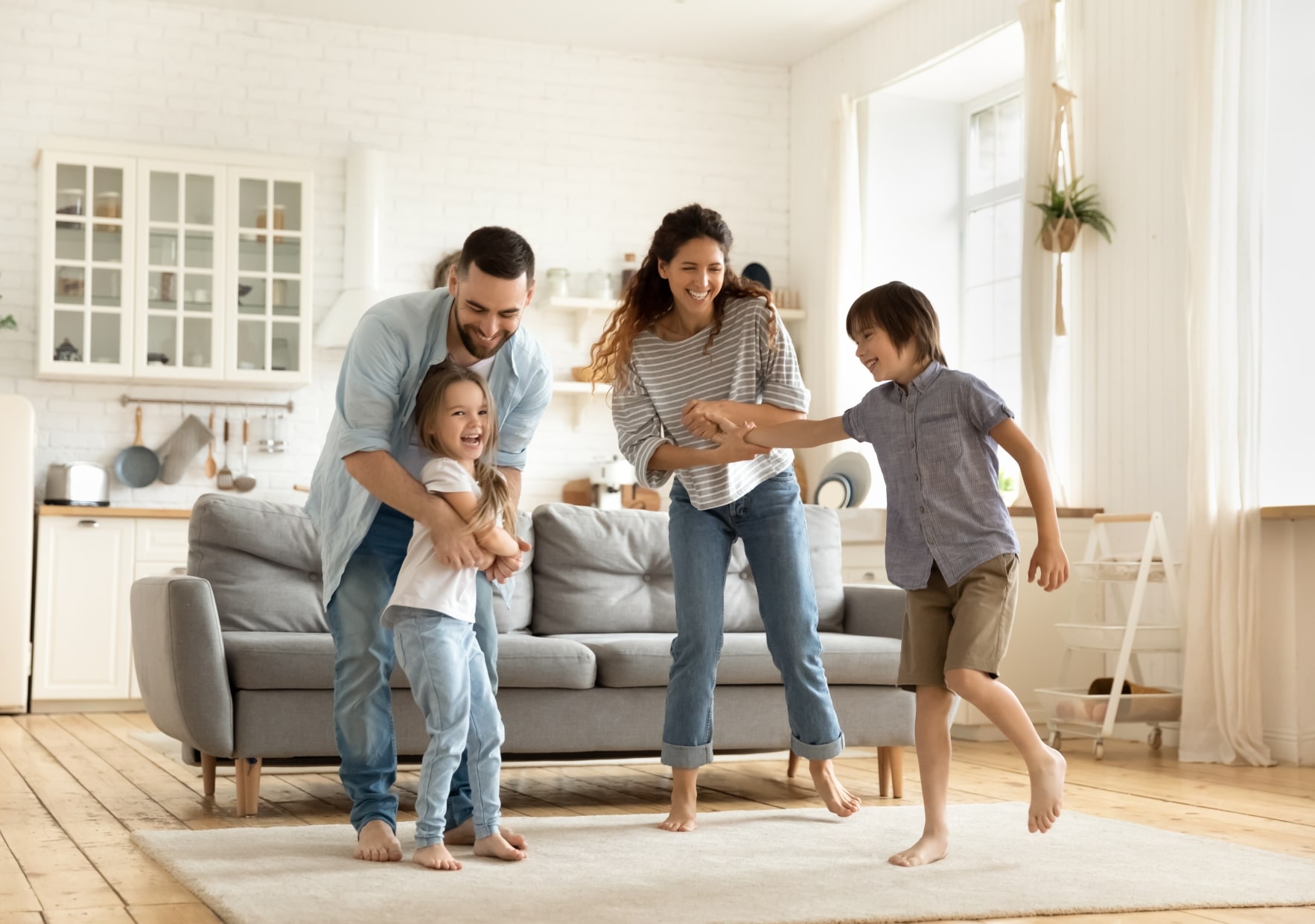 Happy family enjoying Residential HVAC comfort from TechniCool of Utah